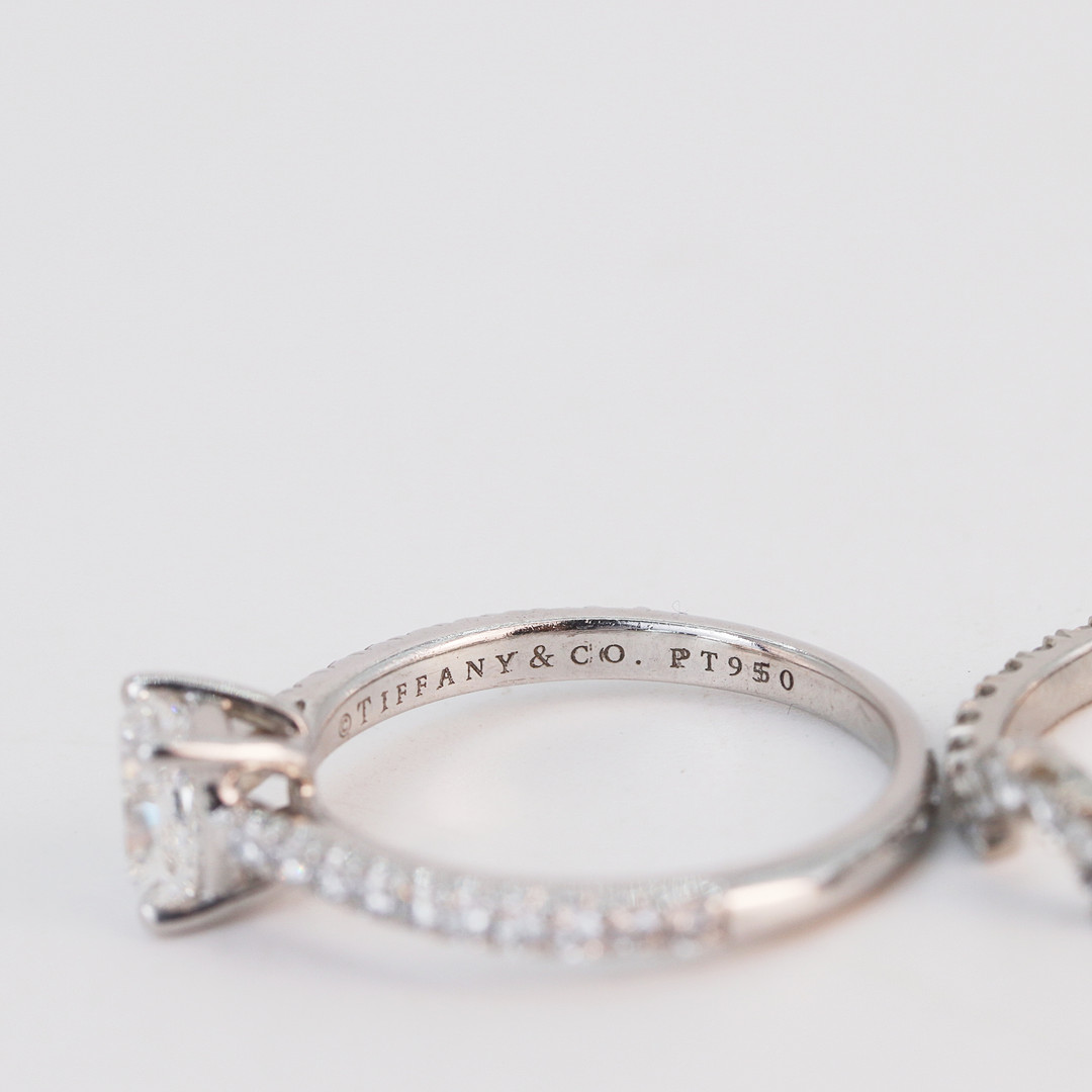 PLATINUM TIFFANY DIAMOND RING AND CAMPANION.