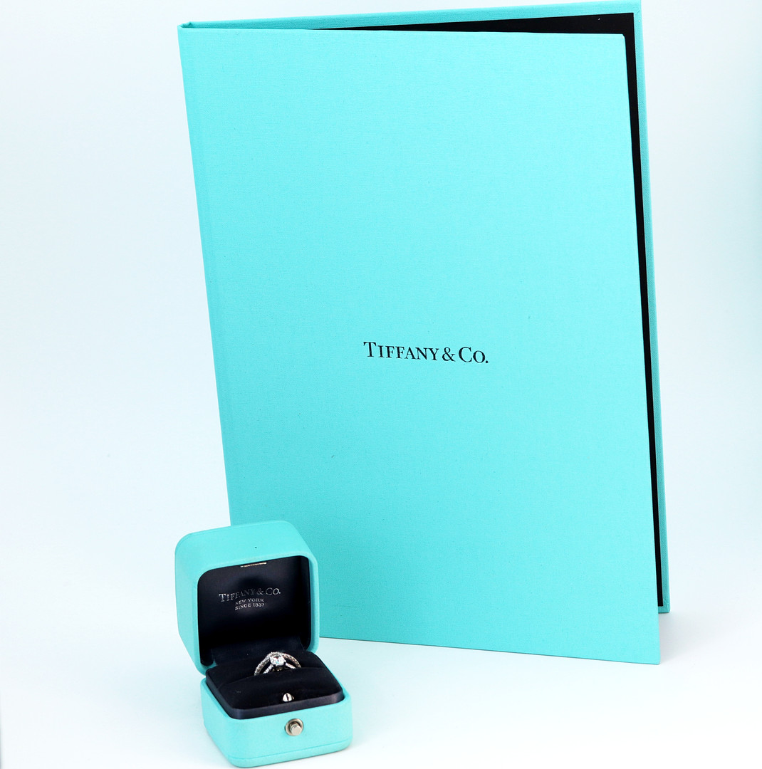 PLATINUM TIFFANY DIAMOND RING AND CAMPANION.