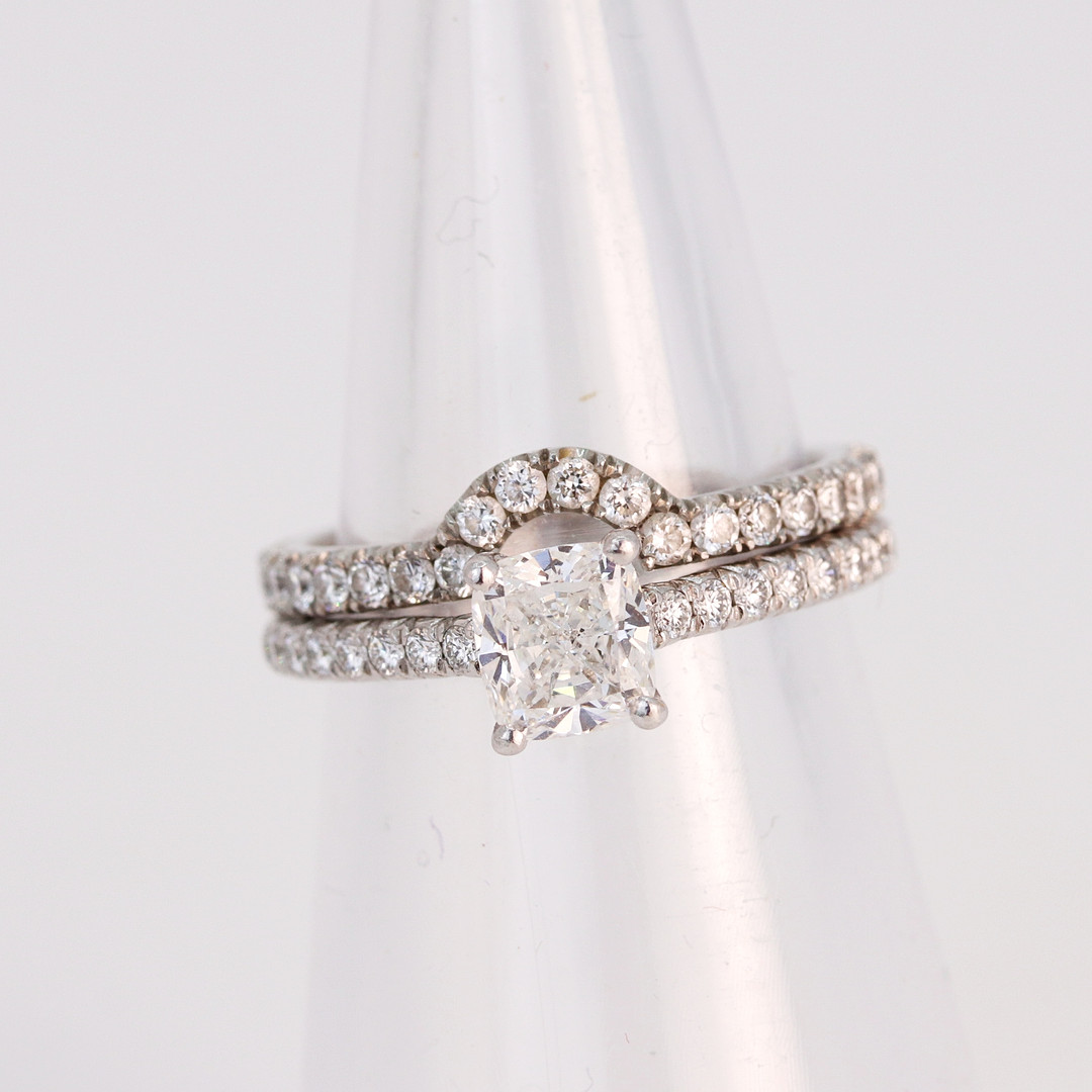 PLATINUM TIFFANY DIAMOND RING AND CAMPANION.