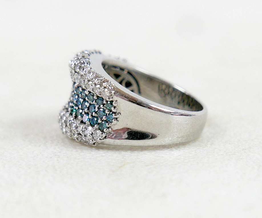 AN 18K WHITE GOLD, DIAMOND, AND BLUE DIAMOND RING.