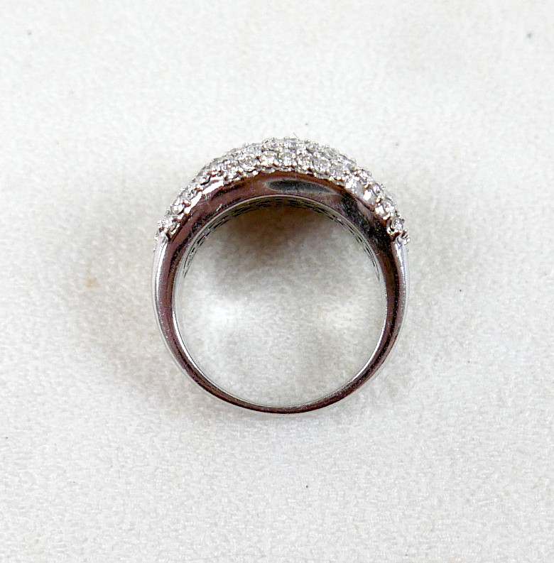 AN 18K WHITE GOLD, DIAMOND, AND BLUE DIAMOND RING.