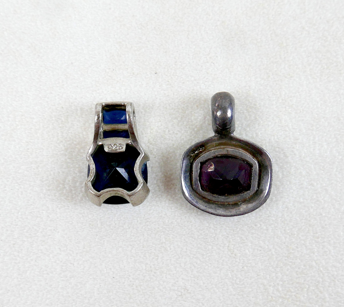 TWO 925 SILVER PENDANTS SET WITH HARDSTONES.