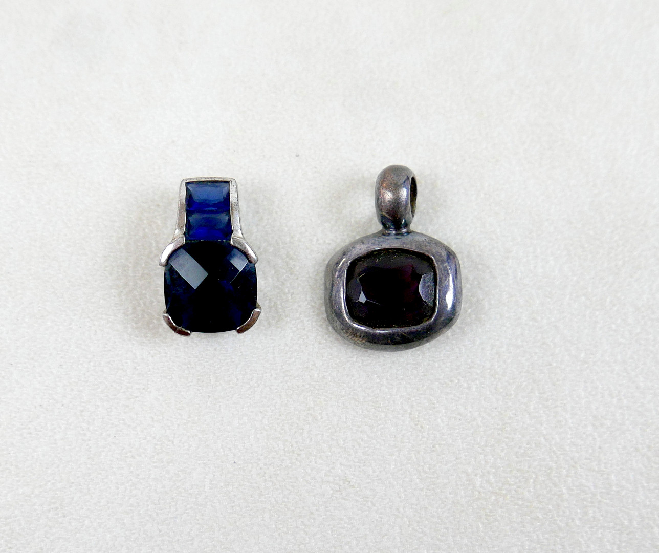 TWO 925 SILVER PENDANTS SET WITH HARDSTONES.