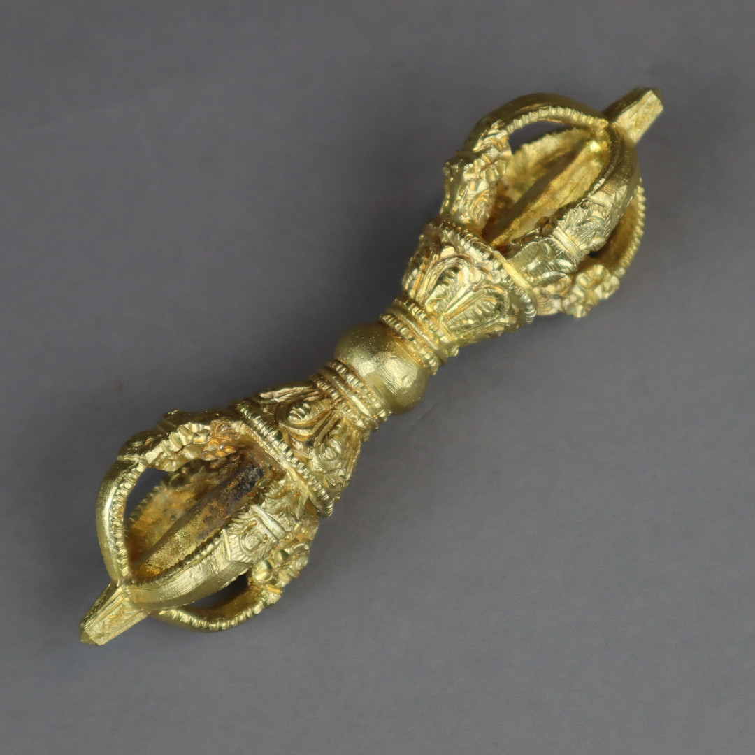 Vierspeichiges Vajra (tib.Dorje) - Tibet/China, Bronze vergoldet.