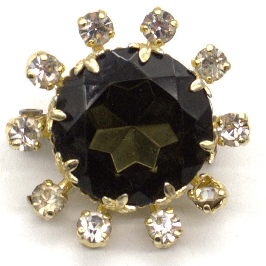 FRANZÖSISCHE STRASS BROSCHE MIT RAUCHGLASFARBIGEN UND WEISSEN FARBSTEINEN UM CA. 1940.