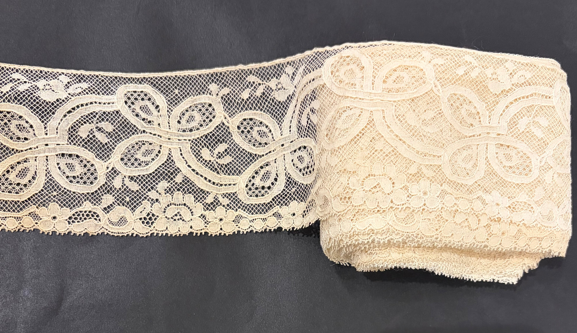 Lace on beige tulle from Brussels, mid 19th Century.