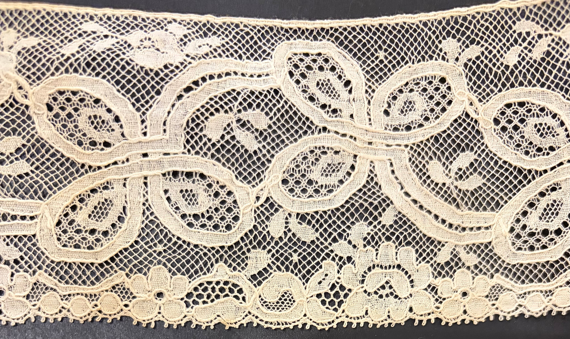 Lace on beige tulle from Brussels, mid 19th Century.