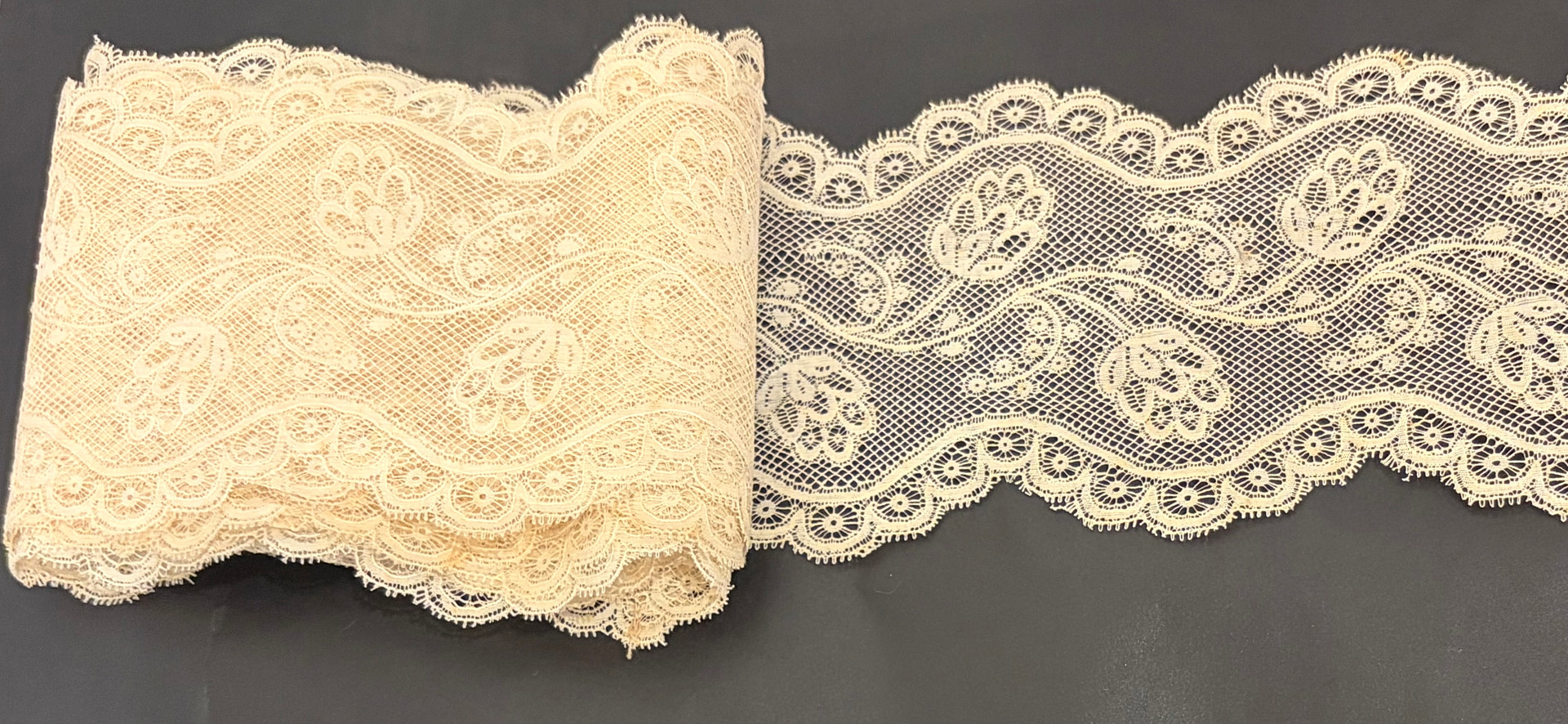 Lace on beige tulle from Brussels, mid 19th Century.