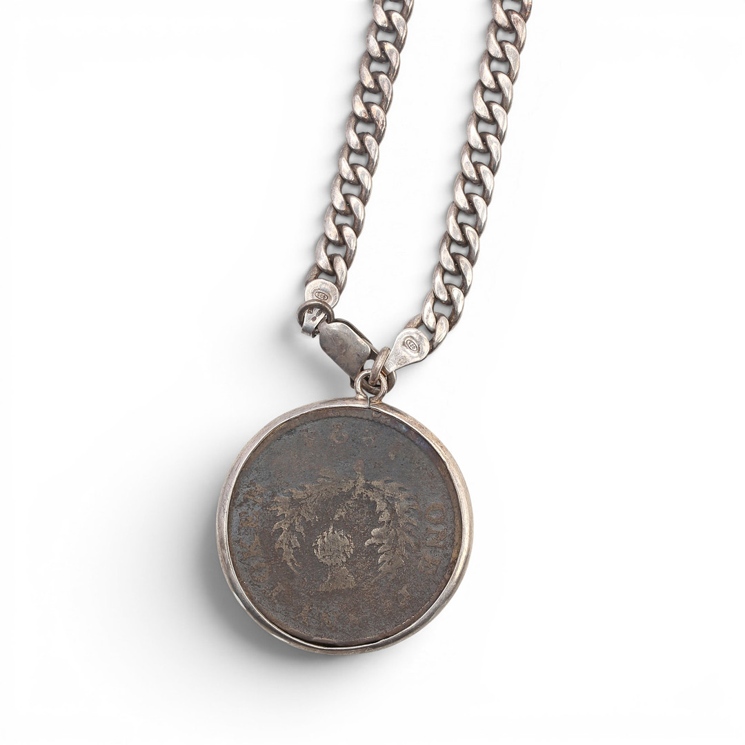 Pendant with a Canadian coin.