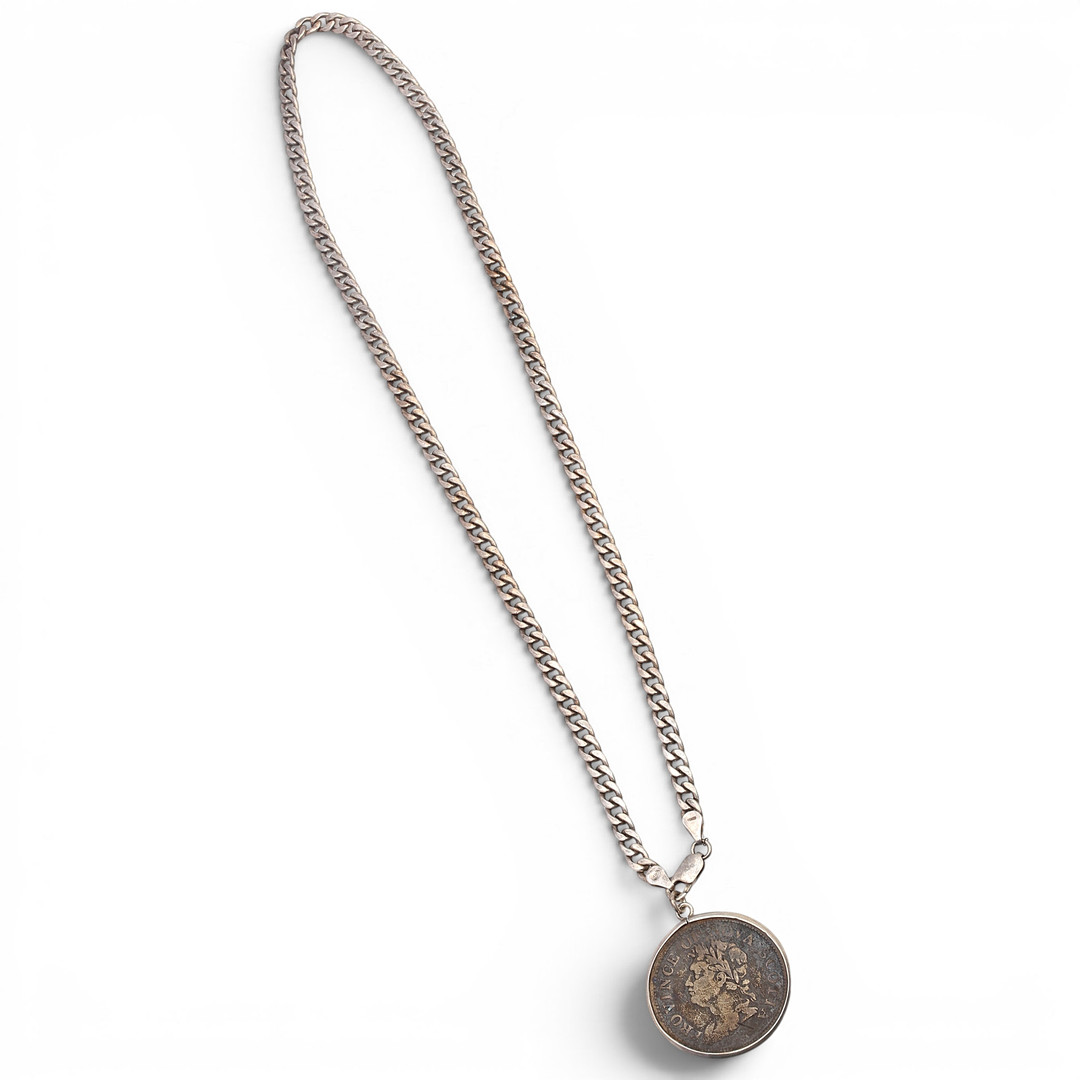 Pendant with a Canadian coin.