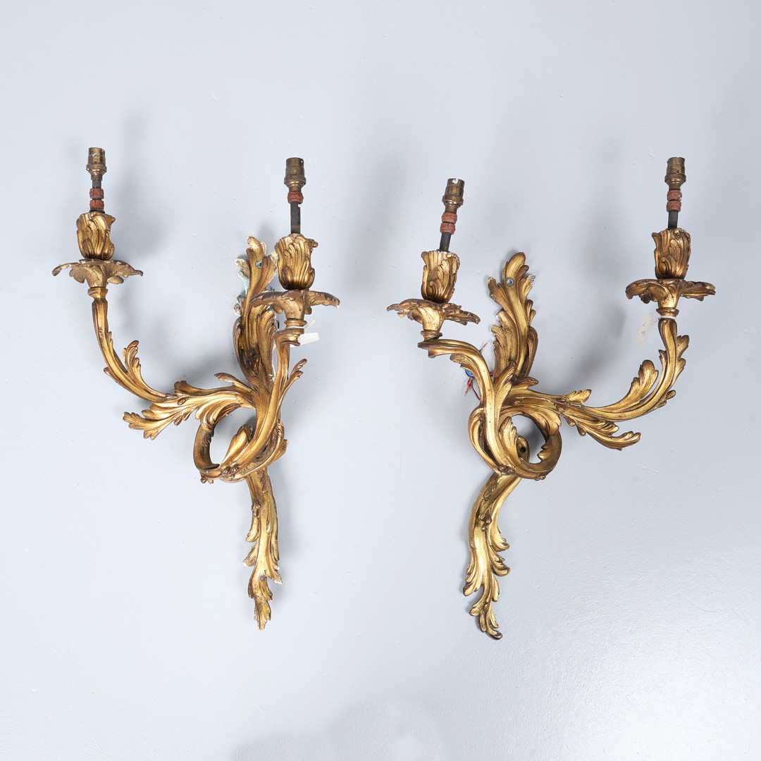 MIRRORED PAIR OF LOUIS XV STYLE GILT BRONZE WALL LIGHT APPLIQUÉS.