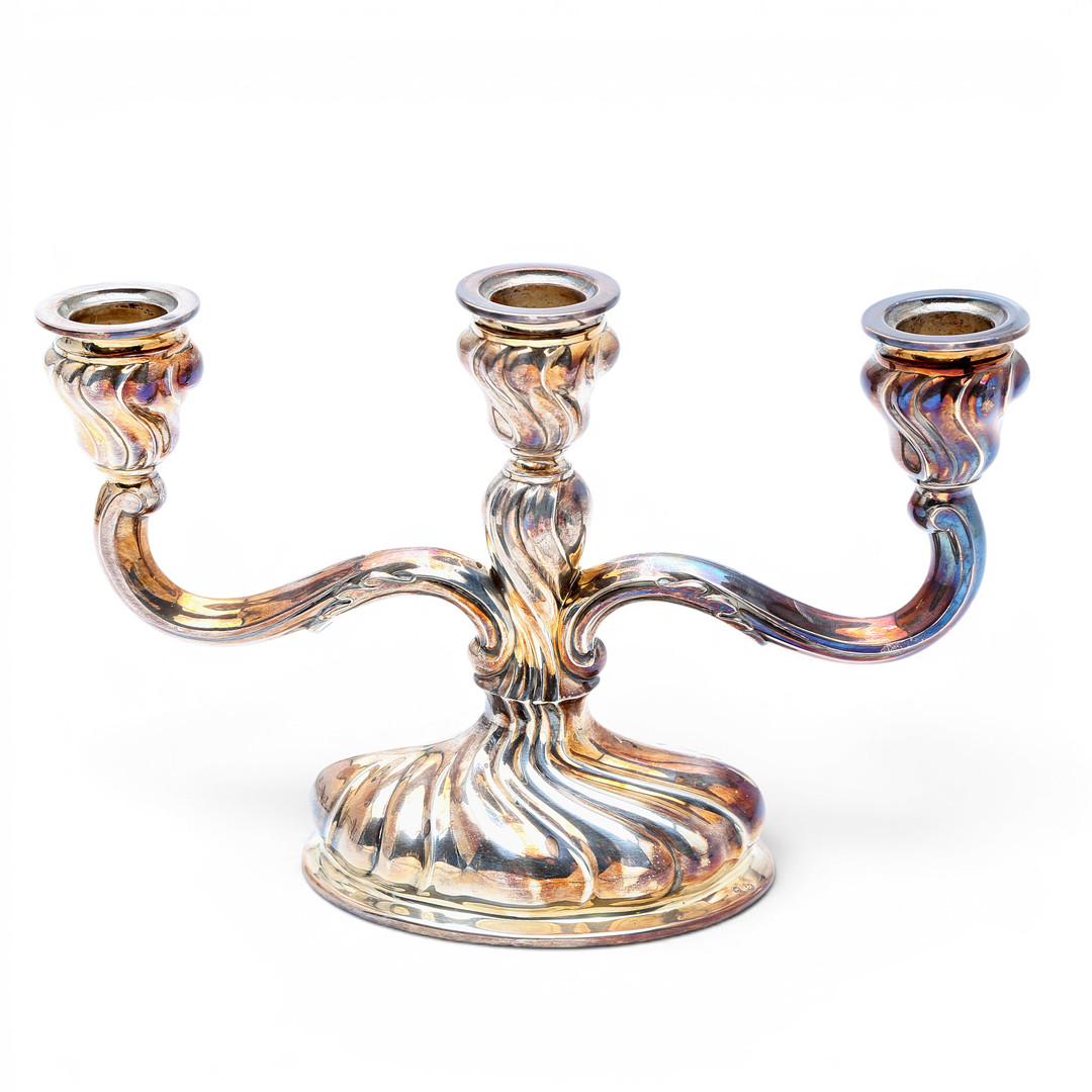 Pair of candelabra and pair of table lamps in silver, third quarter of the 20th Century.