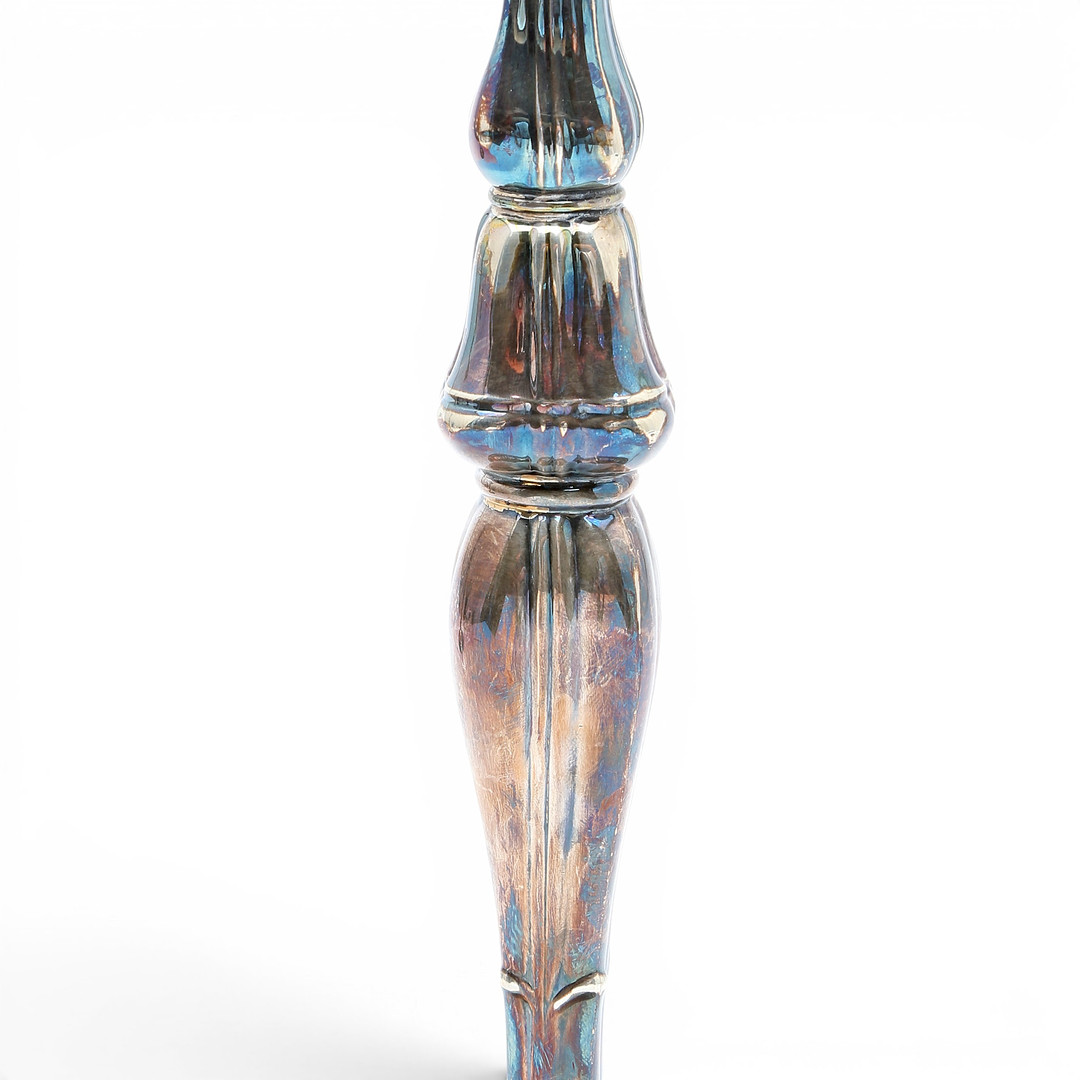 Pair of candelabra and pair of table lamps in silver, third quarter of the 20th Century.