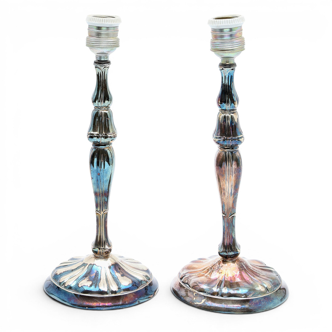 Pair of candelabra and pair of table lamps in silver, third quarter of the 20th Century.