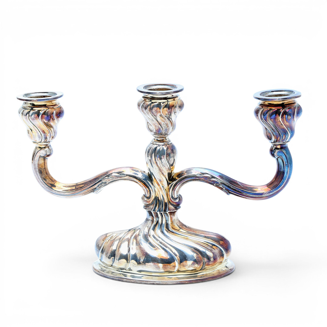 Pair of candelabra and pair of table lamps in silver, third quarter of the 20th Century.