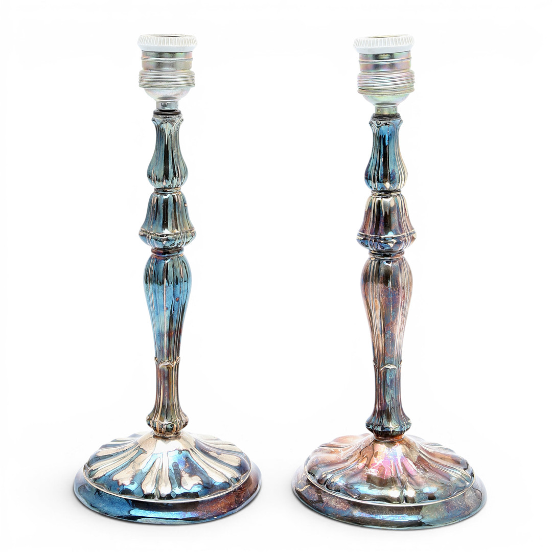 Pair of candelabra and pair of table lamps in silver, third quarter of the 20th Century.