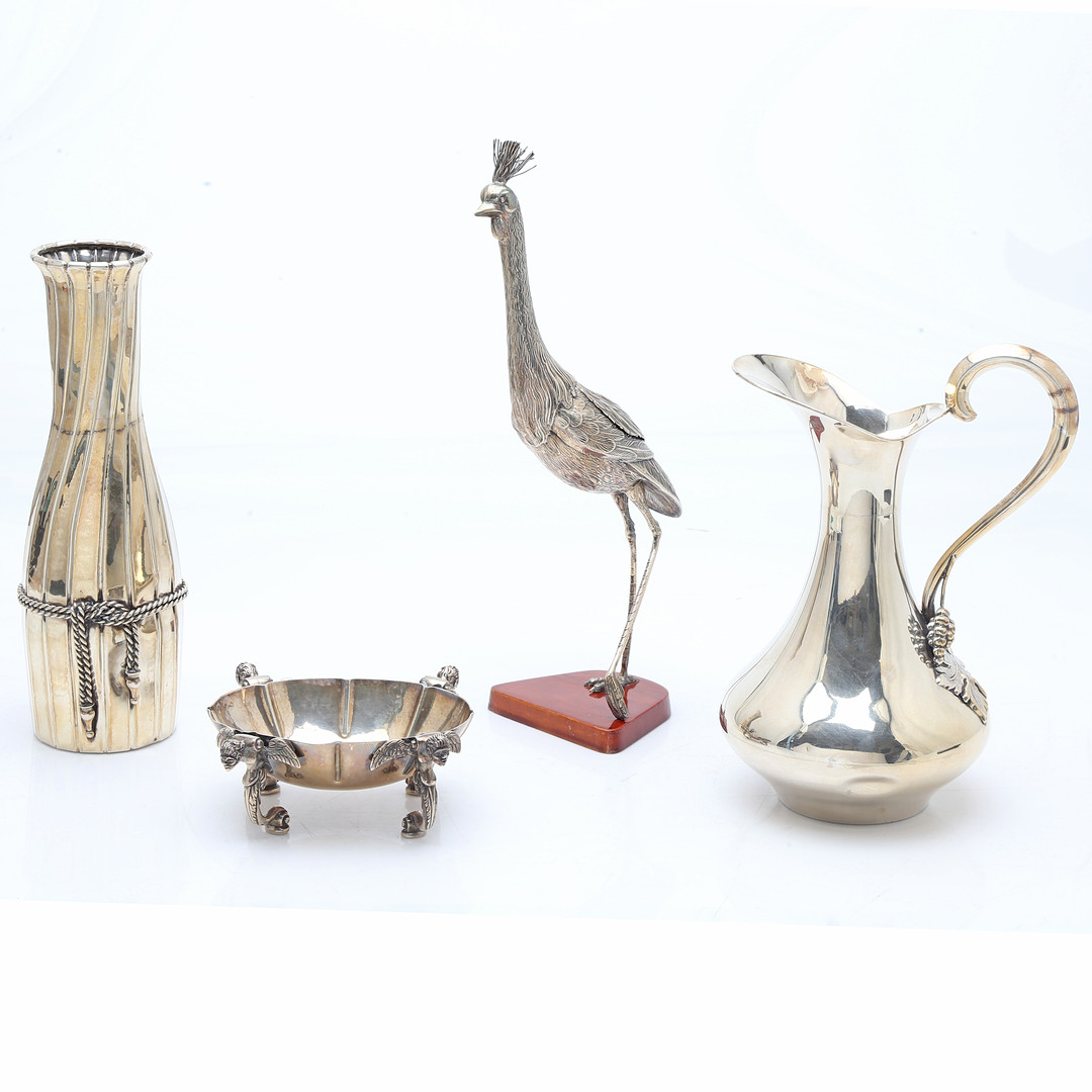 Crane, jug, vase and centrepiece in silver, third quarter of the 20th Century.