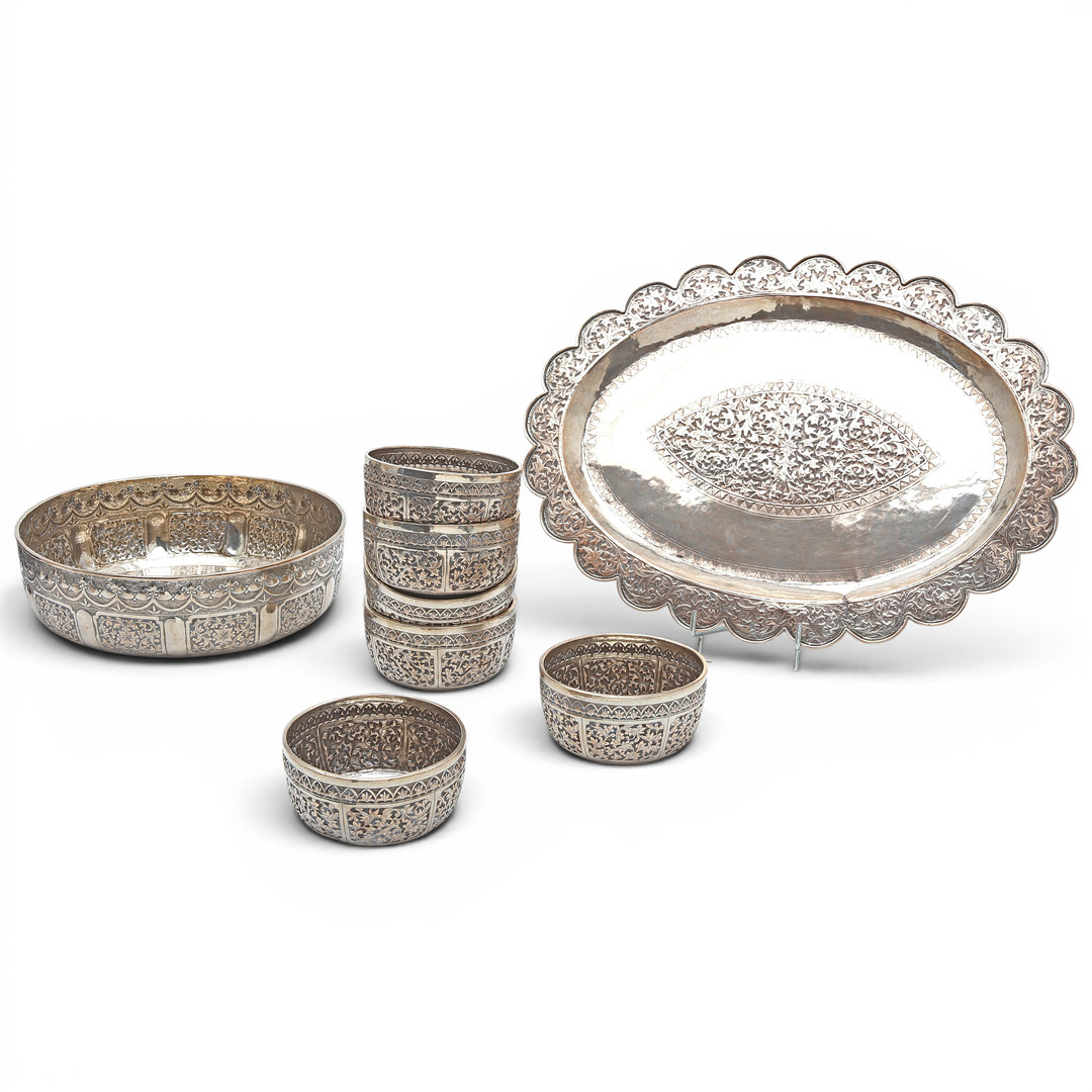 PROBABLY Indian silver-plated metal service set with embossed decoration, third quarter of the 20th century.