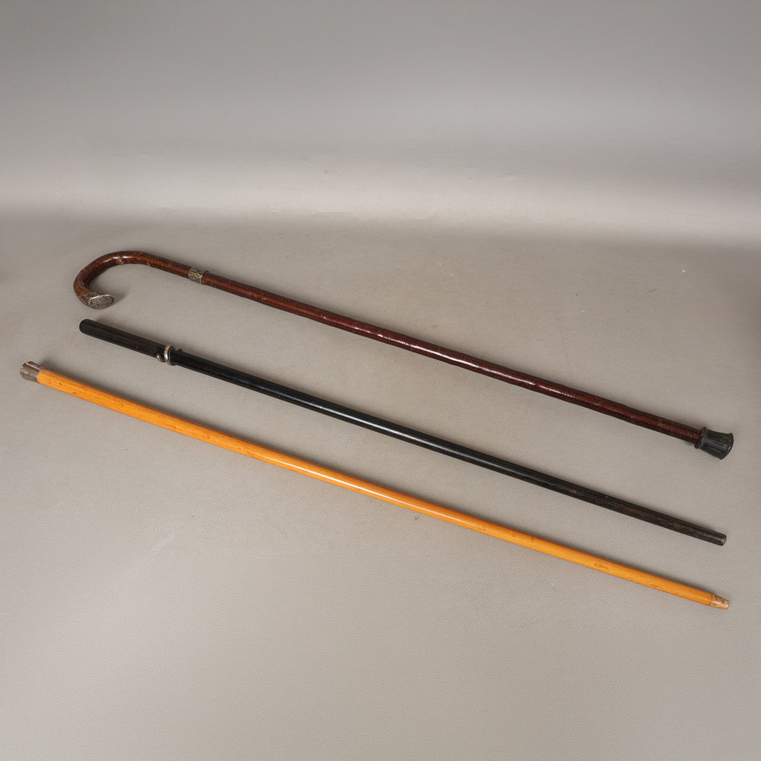 THREE SILVER/ WHITE METAL MOUNTED WAKING CANES (3).