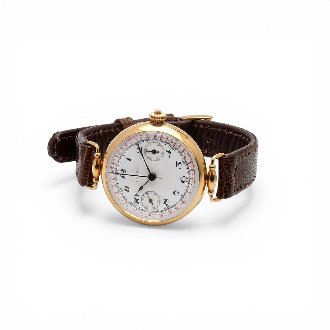 Swiss single-push-button chronograph watch in gold, early 20th Century.