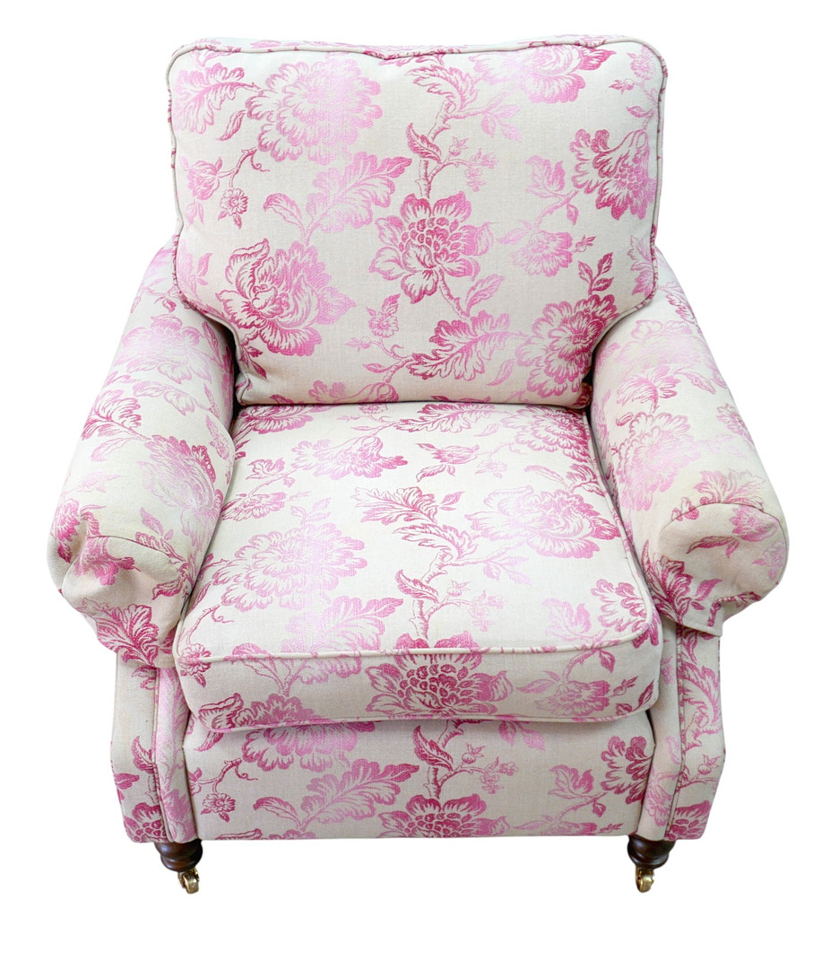 A 20TH CENTURY RECTANGULAR BACKED ARMCHAIR.