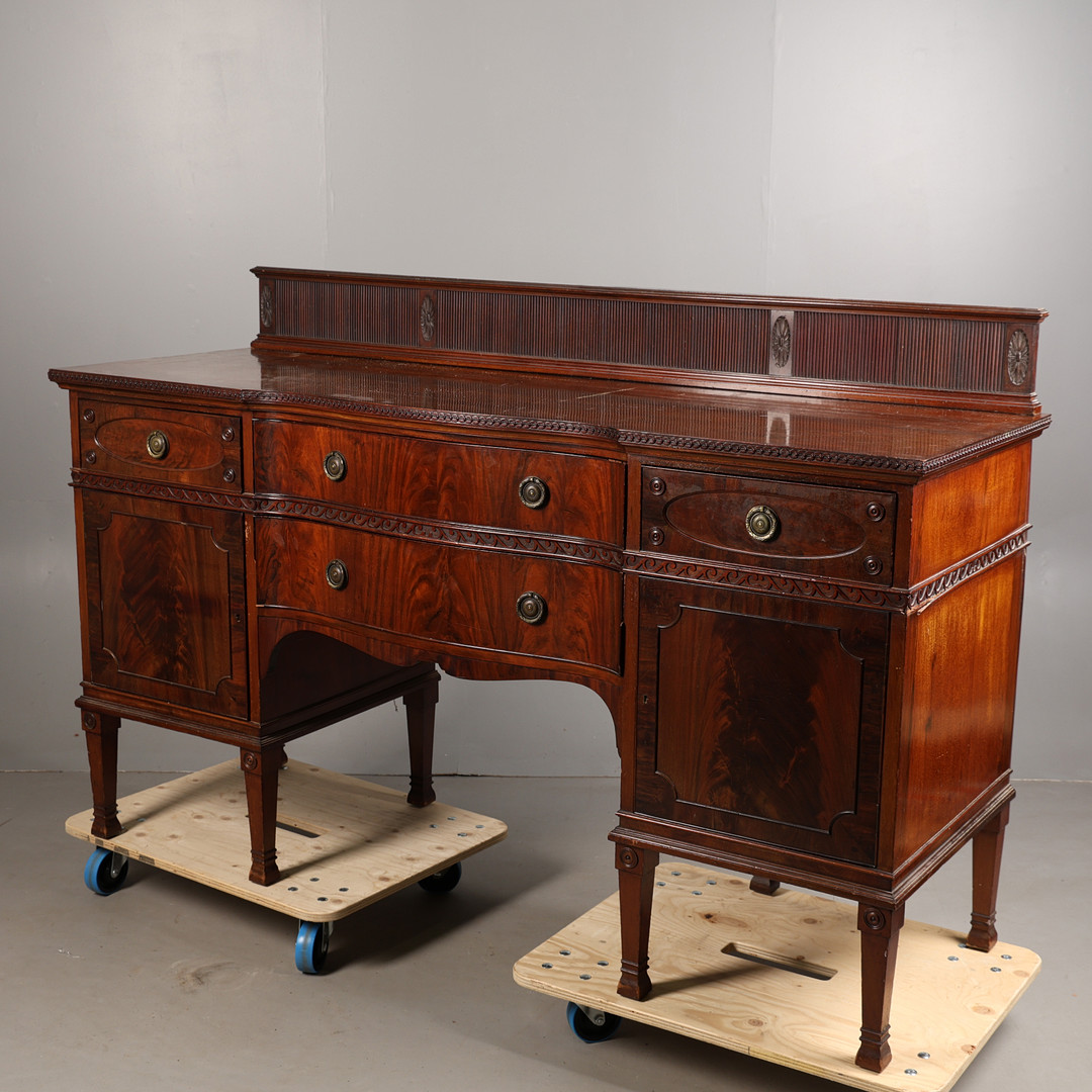 AN EARLY 20TH-CENTURY MAHOGANY BREAK-FRONT SIDEBOARD BY DENBY & SPINKS.