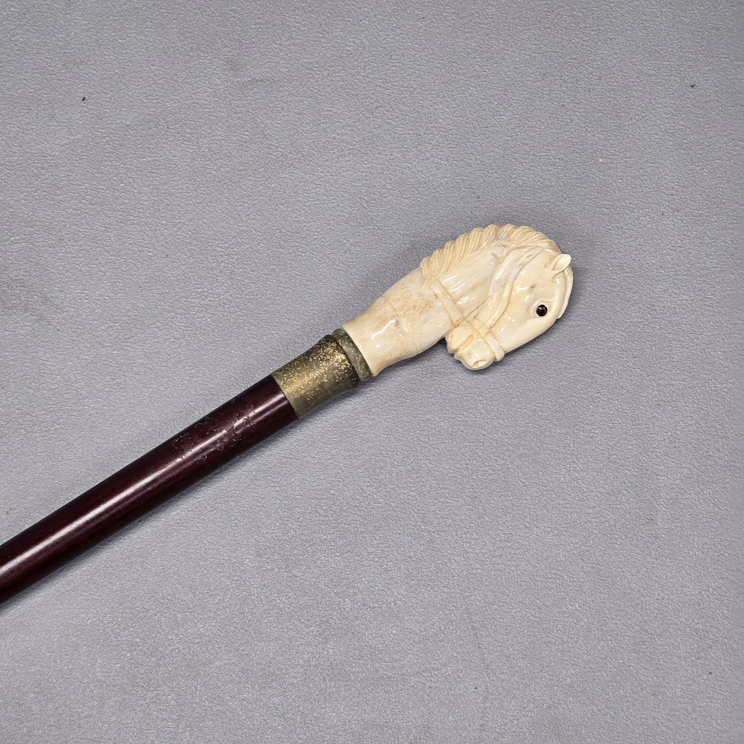 CARVED BONE WALKING STICK.