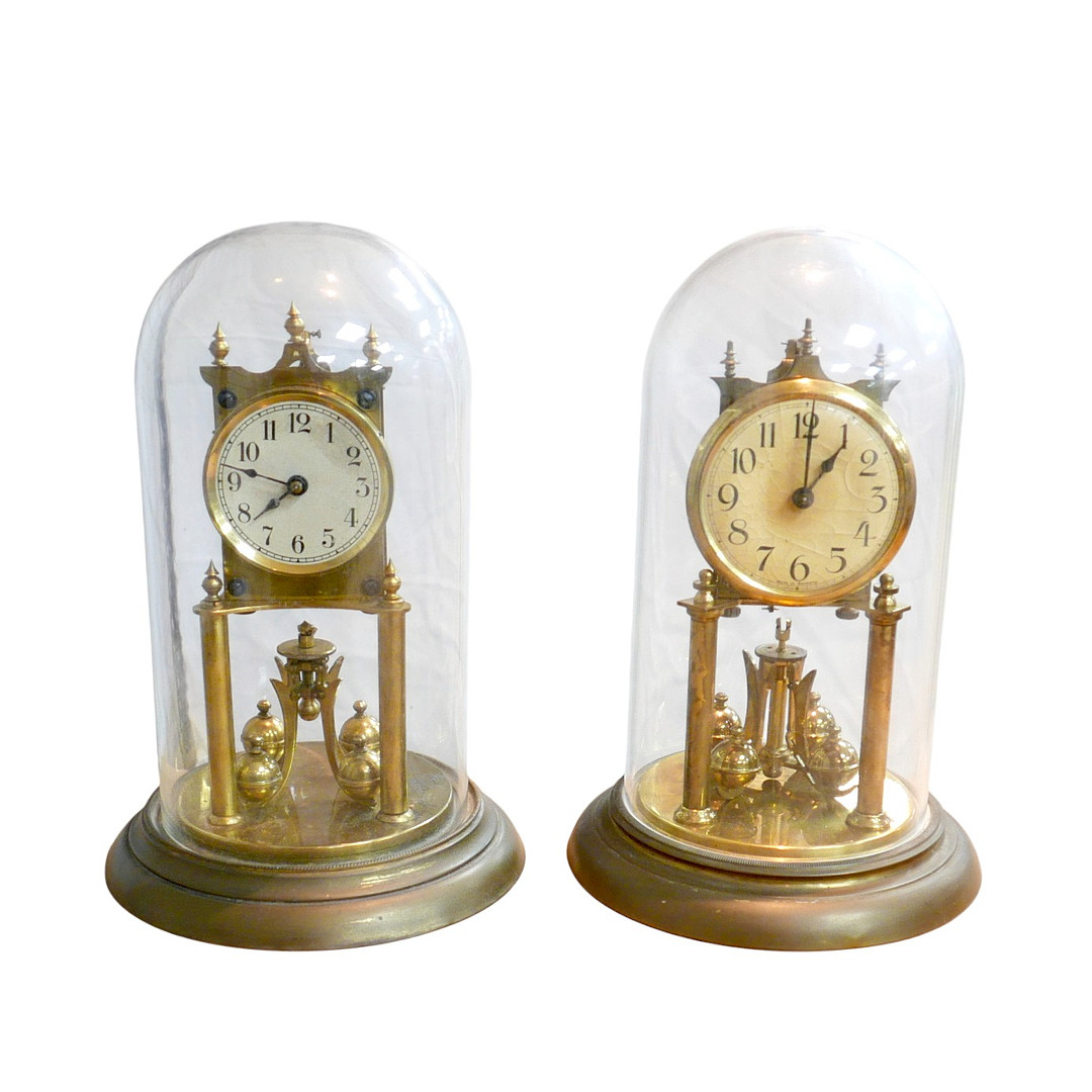 TWO BRASS SKELETON CLOCKS.