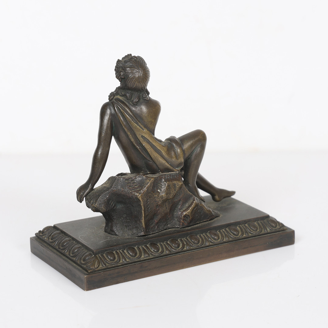 A REGENCY STYLE BRONZE FIGURE.
