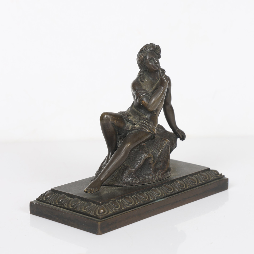 A REGENCY STYLE BRONZE FIGURE.