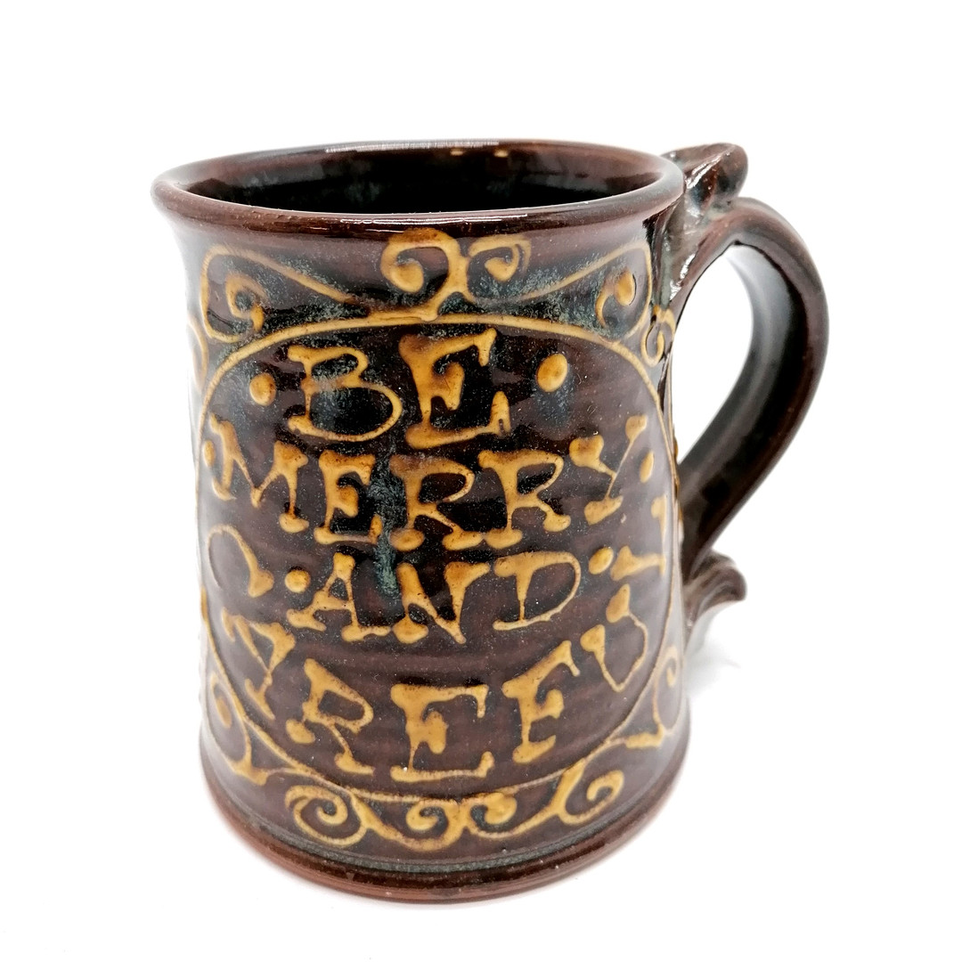 PETER CURRELL BROWN SLIPWARE TANKARD.