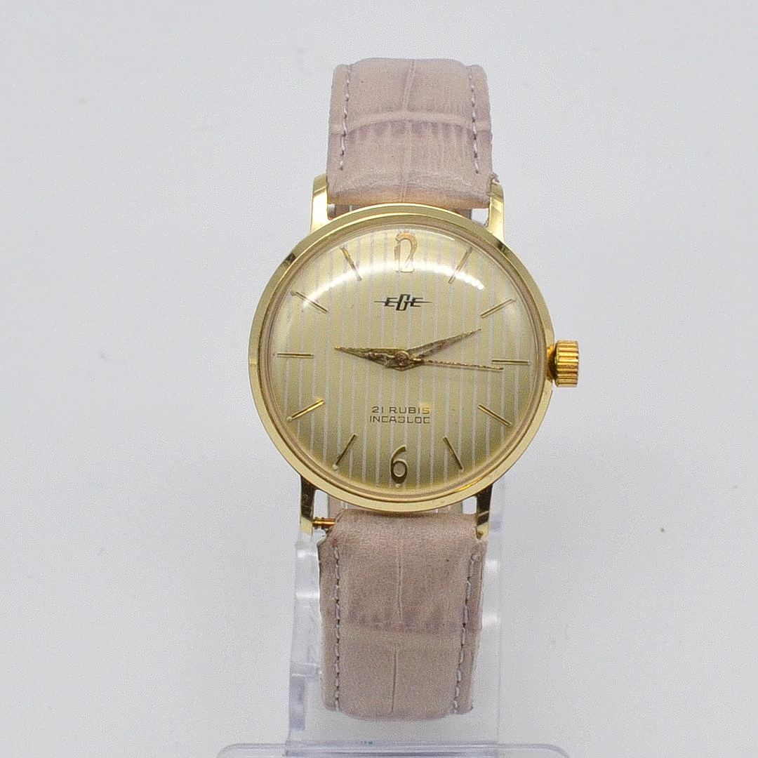 EGE ARMBANDUHR, 21 RUBIS INCABLOC, VERGOLDETES GEHÄUSE, LINIERTES ZIFFERBLATT, HANDAUFZUG, UM 1960ER JAHRE.