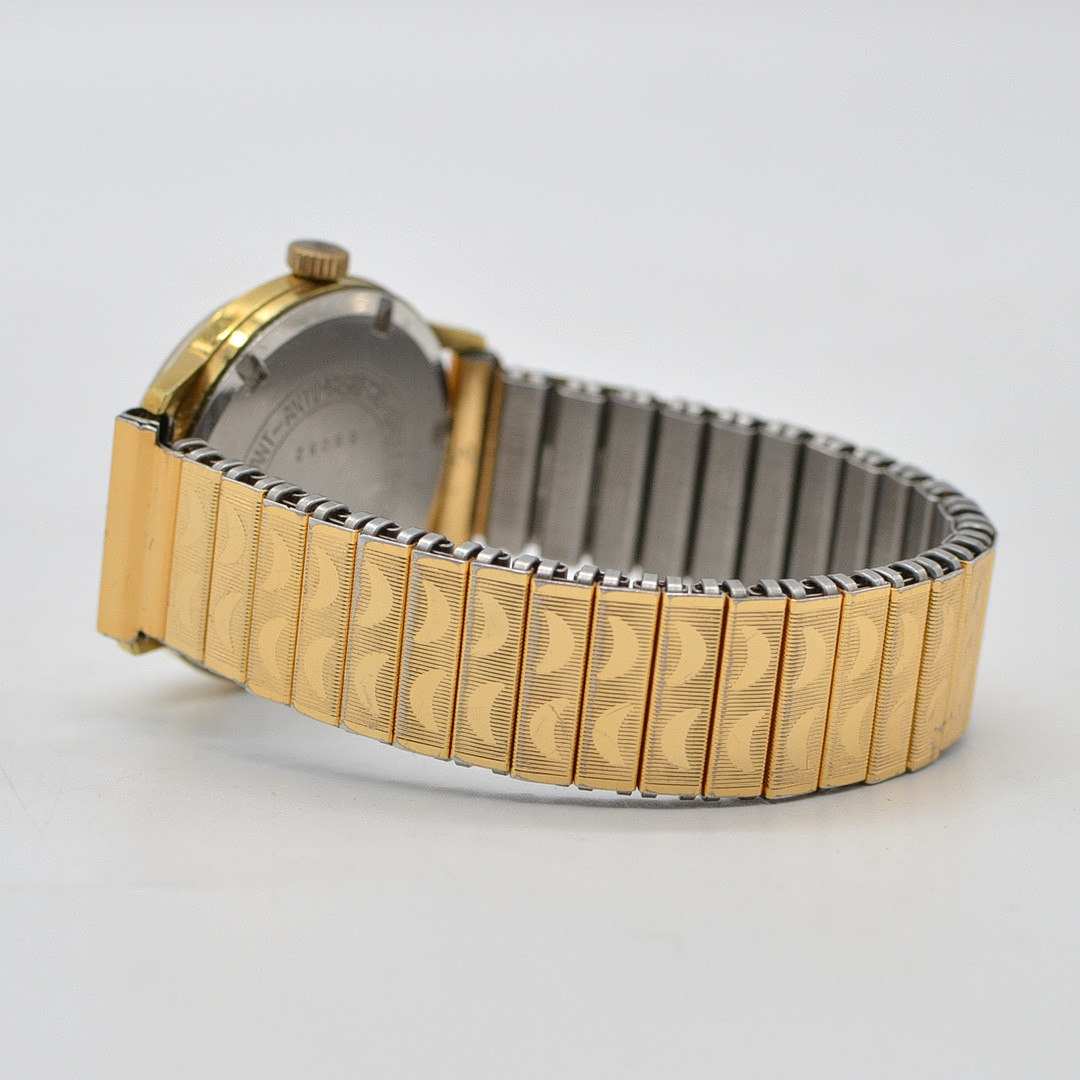 HOUSE OF JOBIN, ARMBANDUHR, 17 JEWELS, INCABLOC, VERGOLDETES GEHÄUSE, HANDAUFZUG, FLEXBAND MIT STRUKTUROBERFLÄCHE, SCHWEIZ, UM 1960.