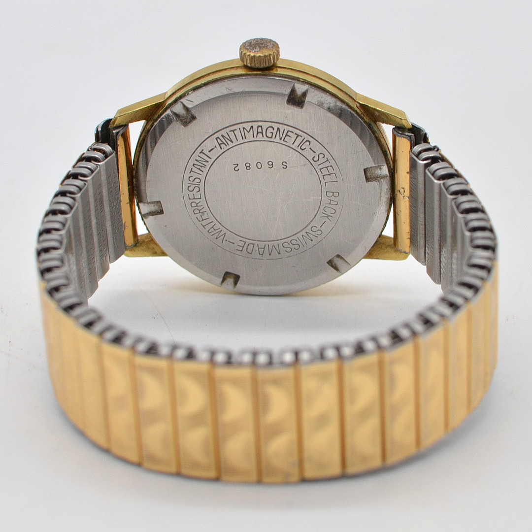 HOUSE OF JOBIN, ARMBANDUHR, 17 JEWELS, INCABLOC, VERGOLDETES GEHÄUSE, HANDAUFZUG, FLEXBAND MIT STRUKTUROBERFLÄCHE, SCHWEIZ, UM 1960.