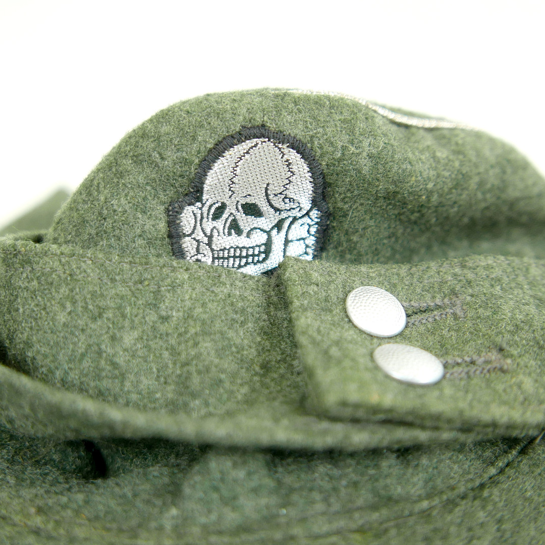 ONE US AND SIX GERMAN WORLD WAR II STYLE MILITARY CAPS.