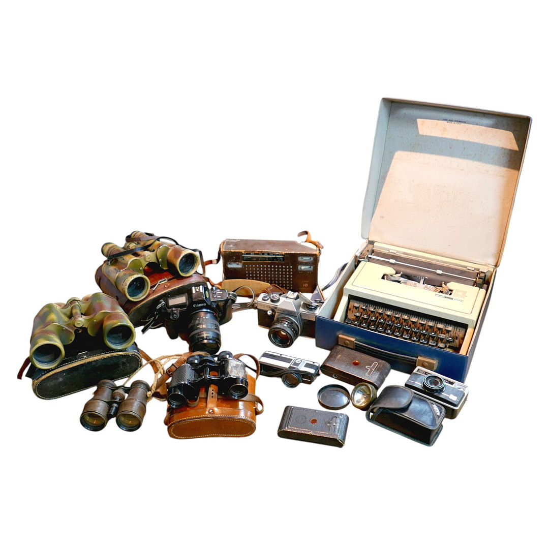 A COLLECTION OF ASSORTED BINOCULARS RETRO CAMERAS AND OTHER ITEMS.