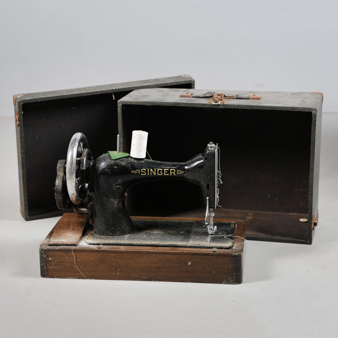 A SINGER SEWING MACHINE.