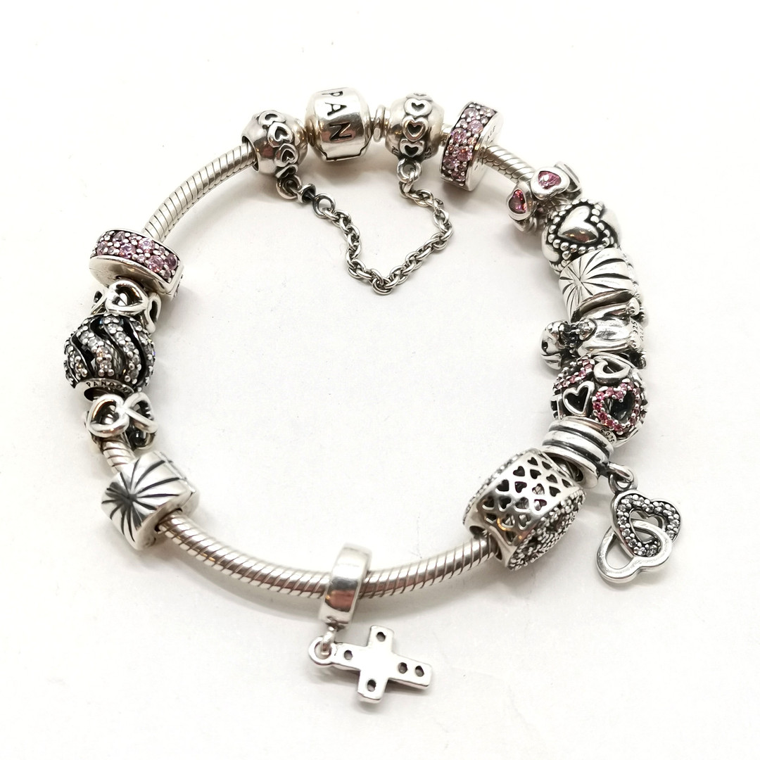 PANDORA SILVER BRACELET W/ CHARMS.