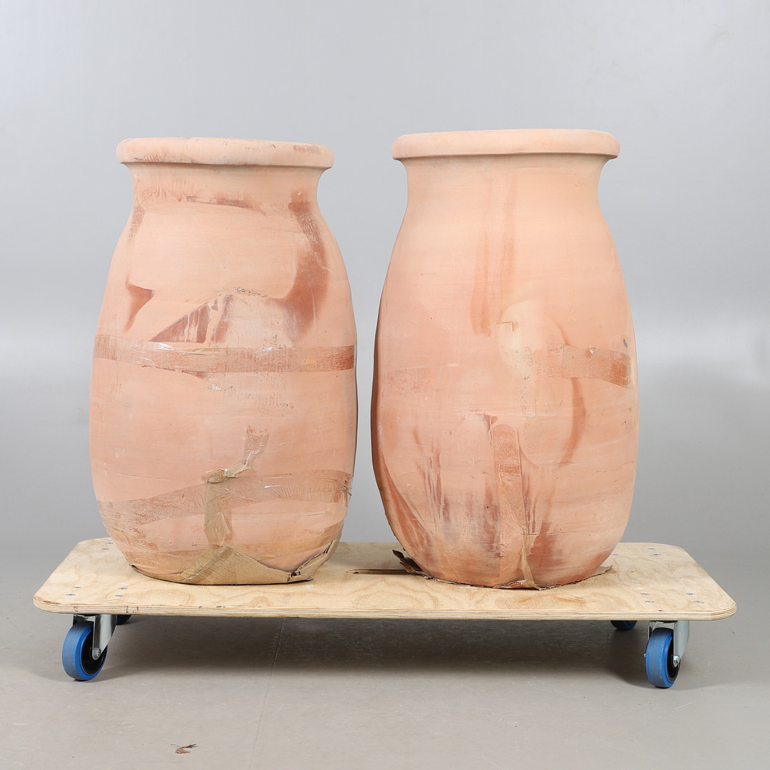 A PAIR OF EGYPTIAN TERRACOTTA PLANTERS.