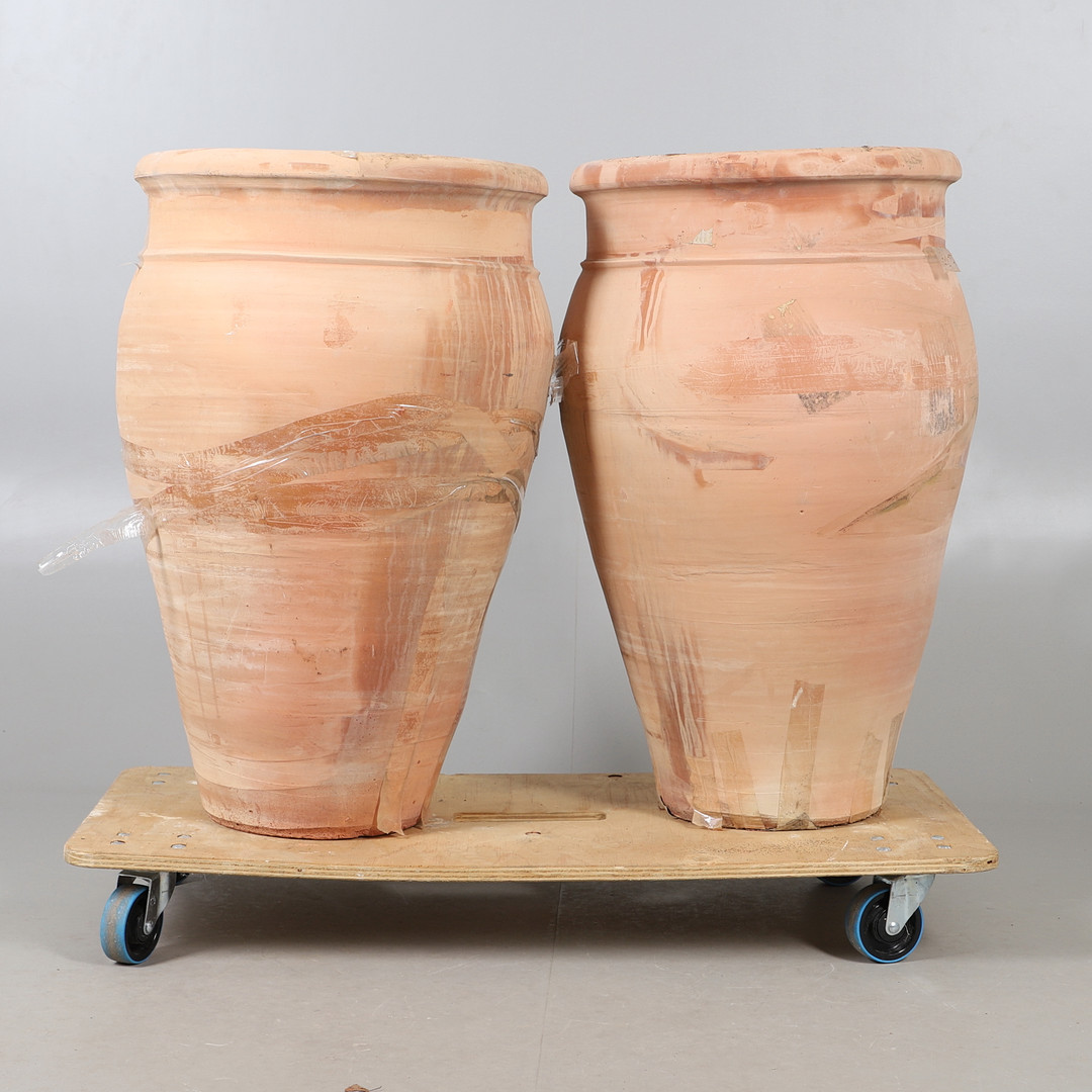 A LARGE PAIR OF MODERN EGYPTIAN TERRACOTTA PLANTERS.