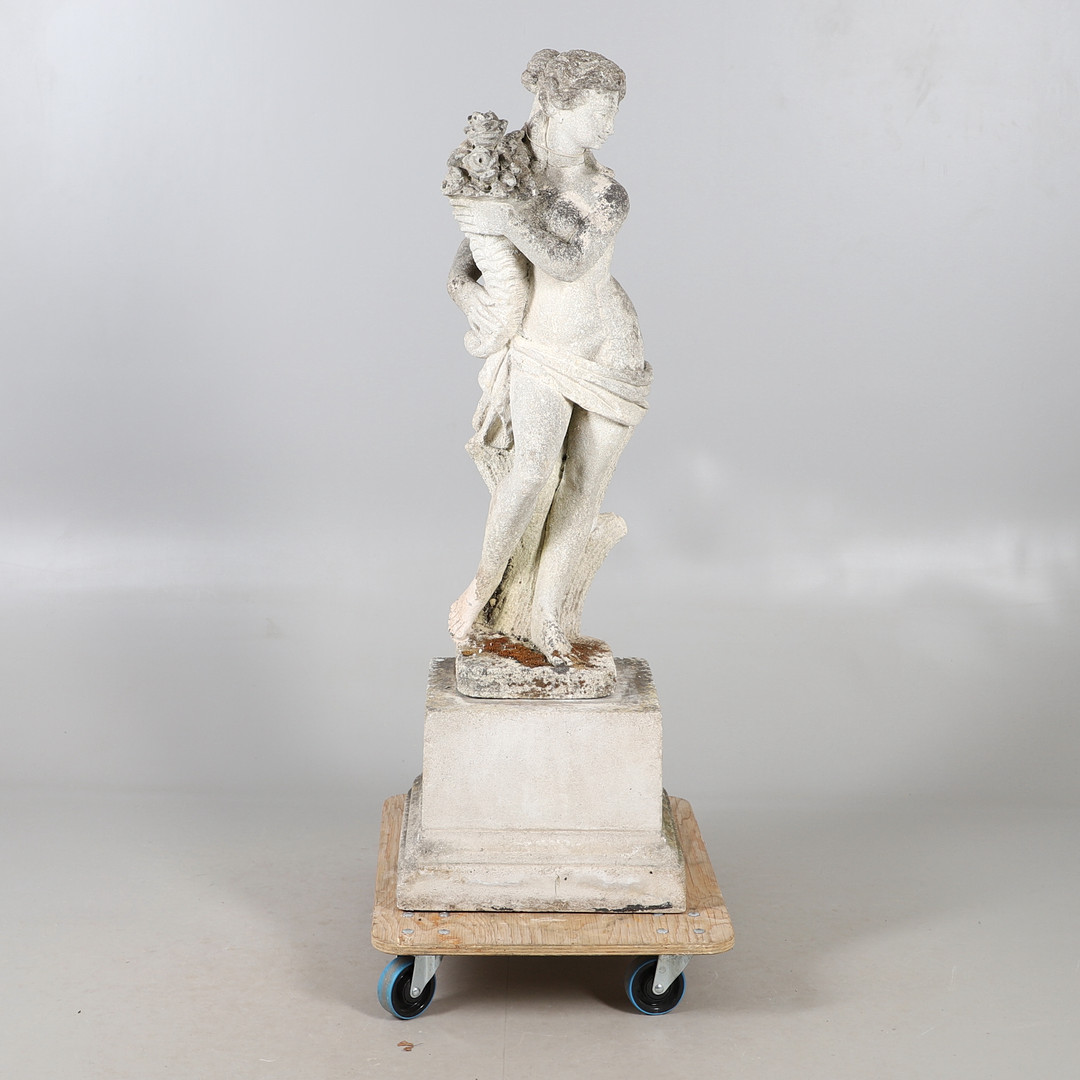 A CARVED STONE CLASSICAL MAIDEN ON COMPOSITE STAND.