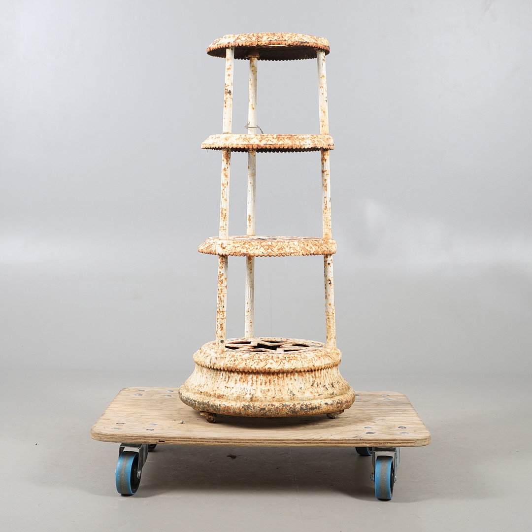 A KENRICK & SONS CAST IRON POT STAND.
