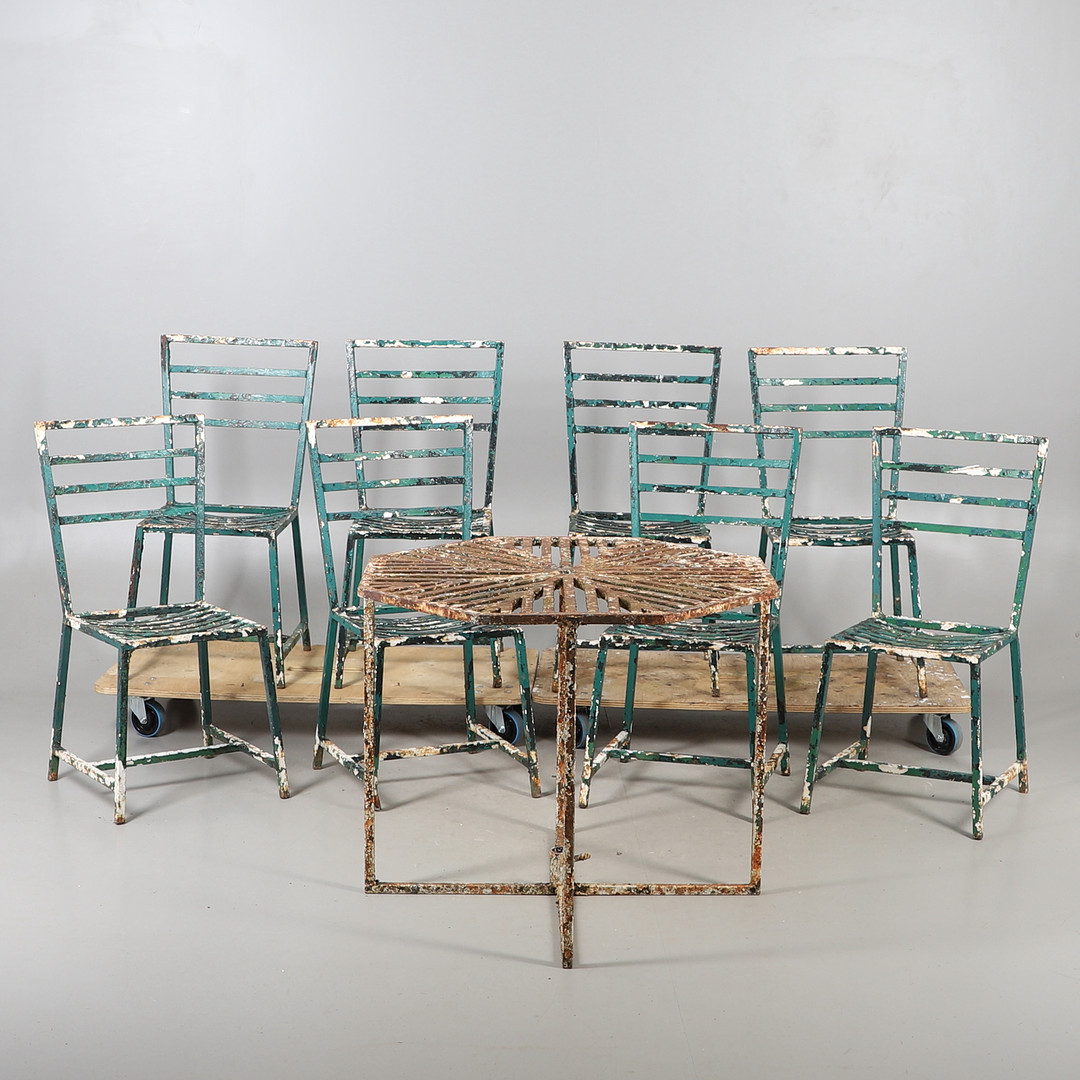 A PAINTED CAST IRON GARDEN TABLE AND CHAIRS.
