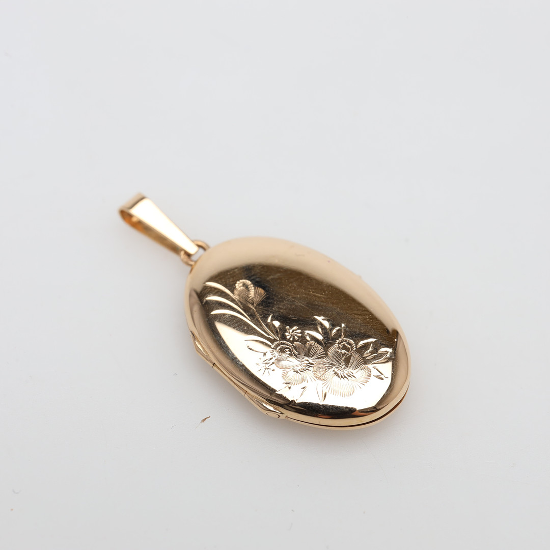 MEDALJONG 18K guld, vikt ca 3,3 gram.
