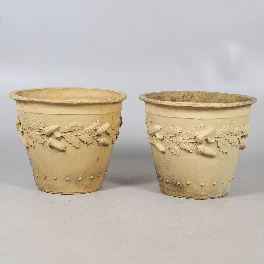 A PAIR OF IMITATION TERRACOTTA FIBREGLASS POTS.