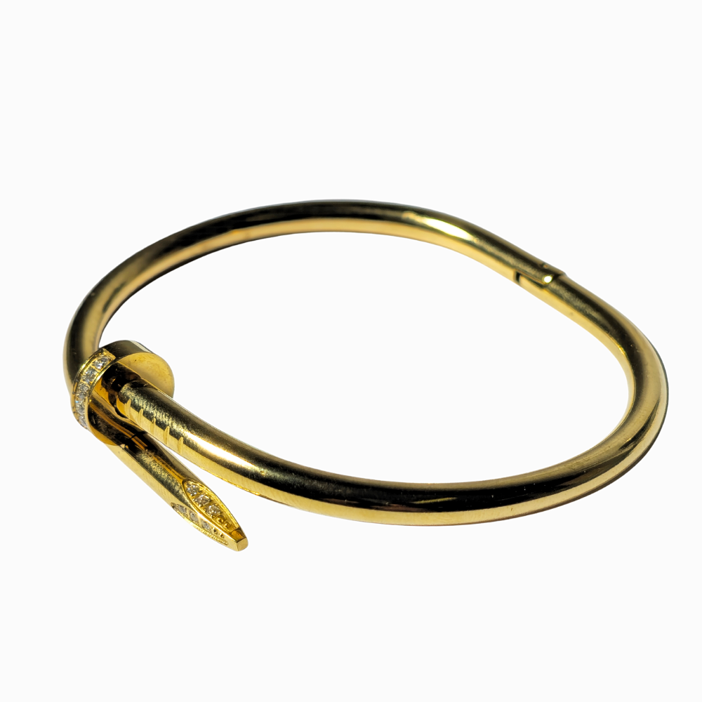 Pulsera clavo en acero con baño de oro.