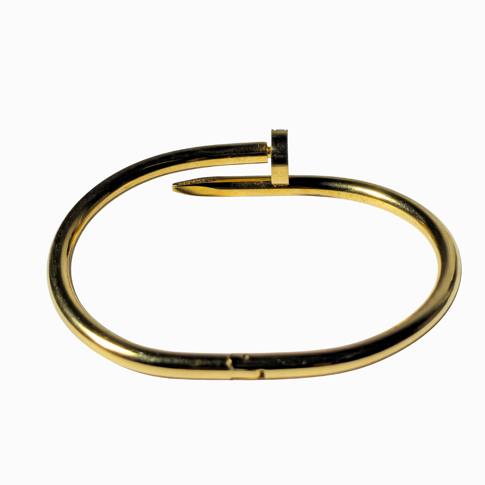 Pulsera clavo en acero con baño de oro.