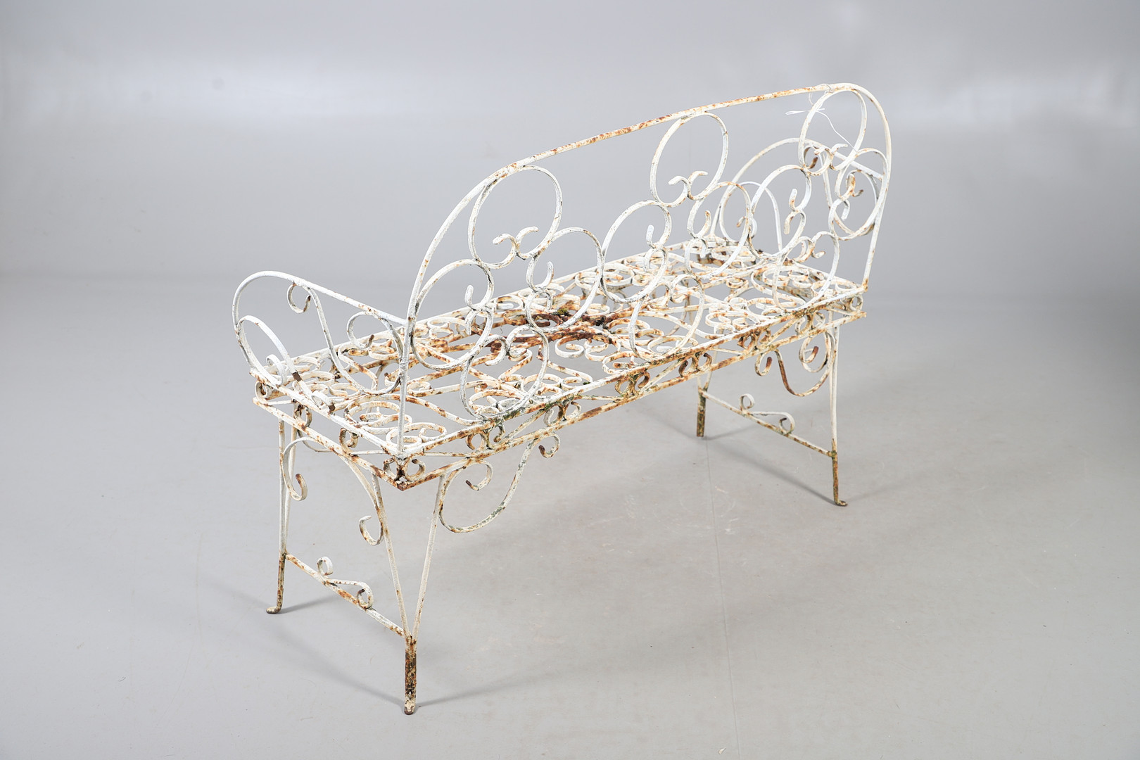 WROUGHT IRON GARDEN BENCH AND TABLE.