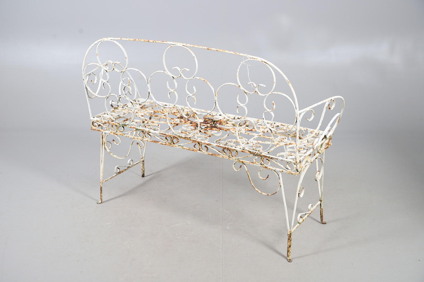 WROUGHT IRON GARDEN BENCH AND TABLE.
