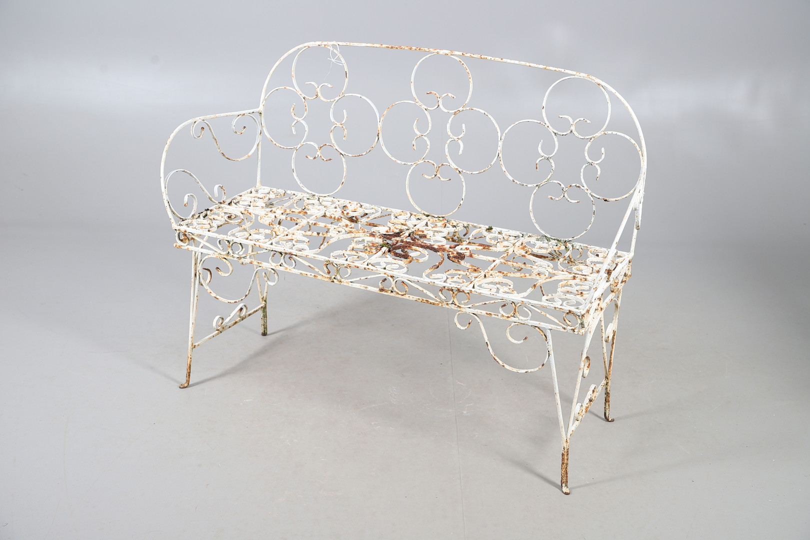 WROUGHT IRON GARDEN BENCH AND TABLE.